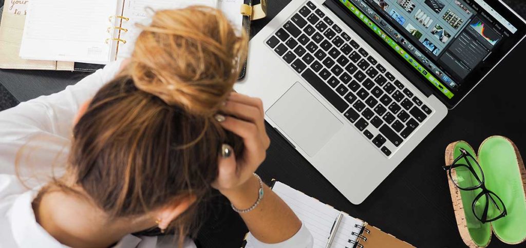 Woman With Neck Pain At Work